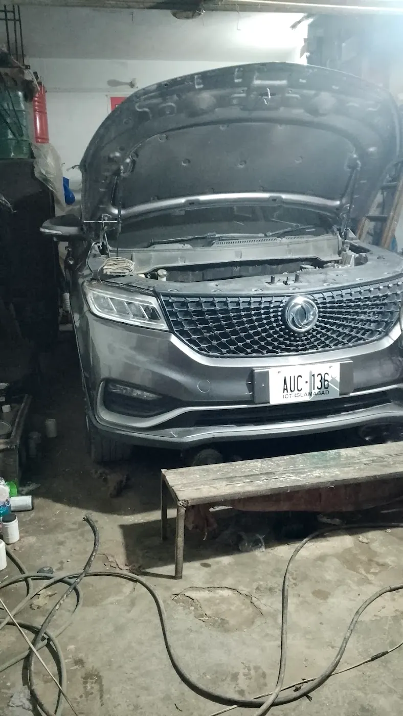 Car on the lift, bonnet open
